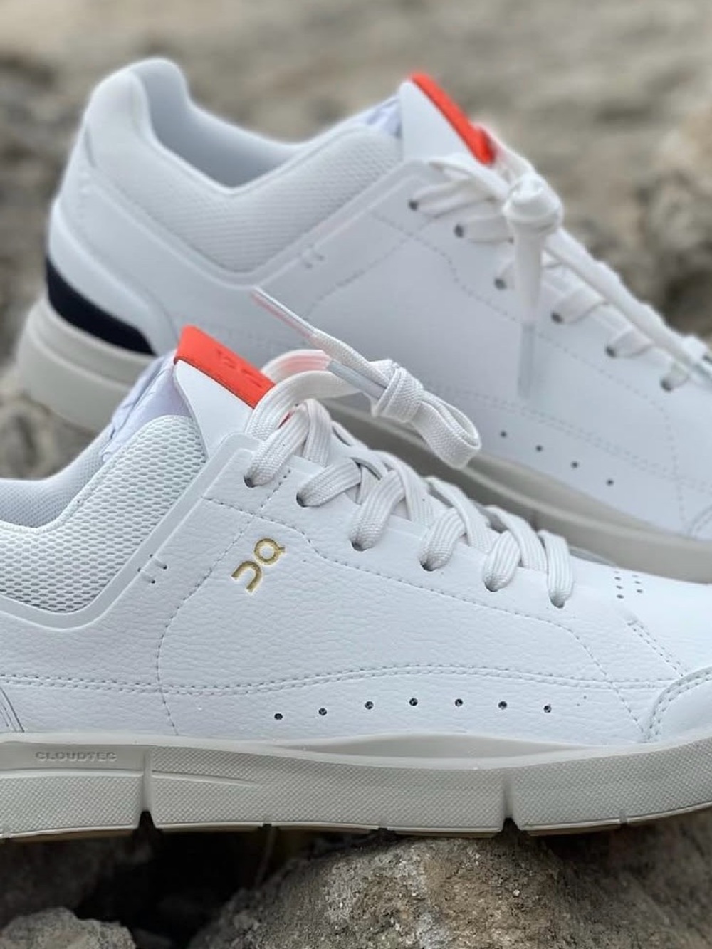 On Running White Low-Top Sneakers with Coral Tongue and Gold Logo